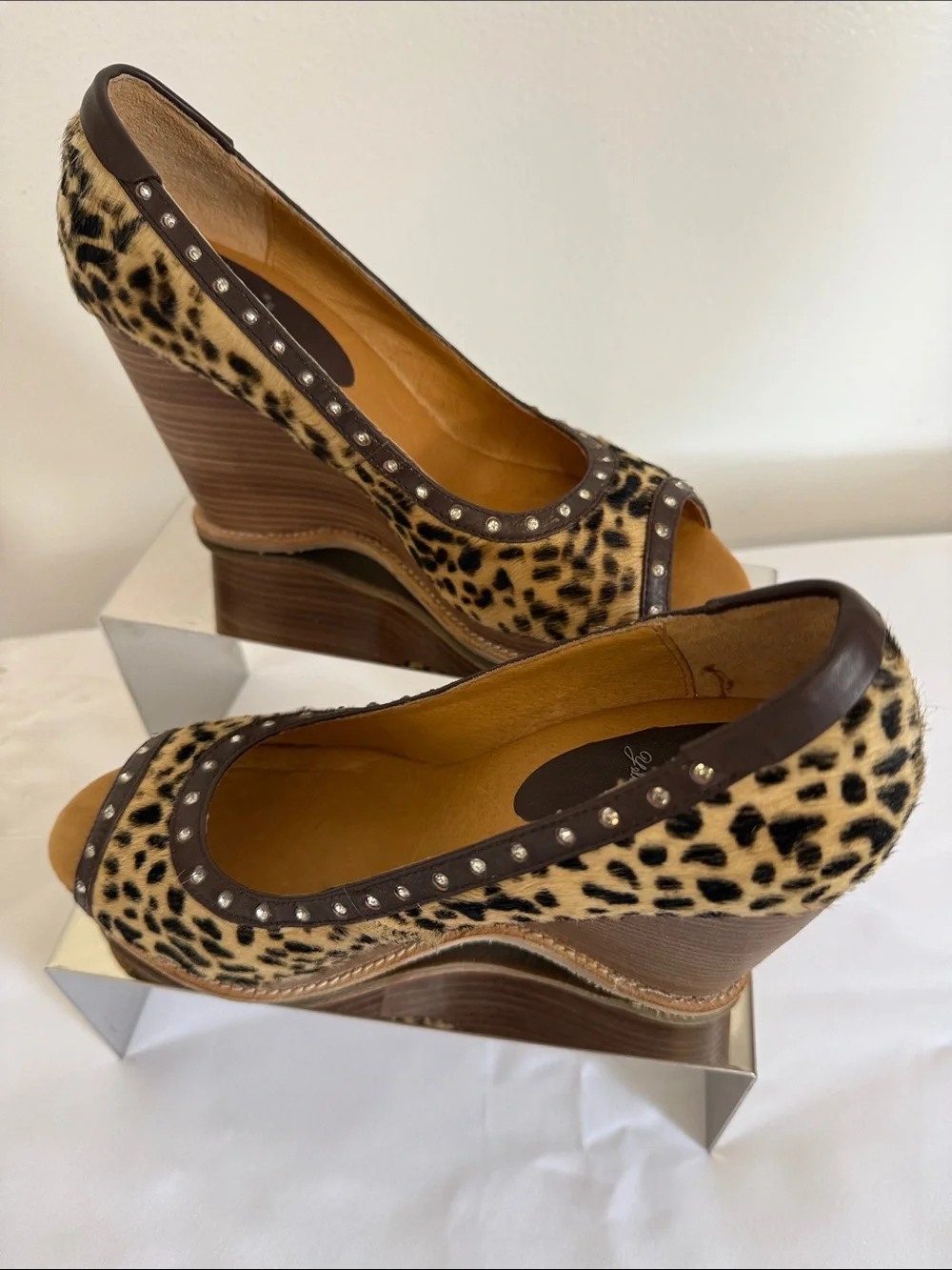 Animal print wedges with rhinestone trim. Leather upper size 8.
